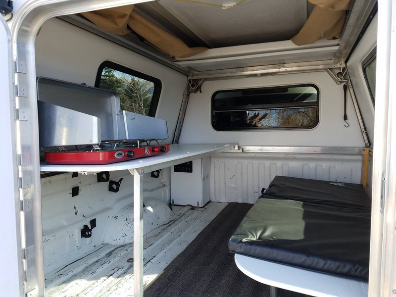 Illustration for article titled At $14,500, Could This 2004 Toyota Tundra TRD Camper Have You Saying Get Outta Town?